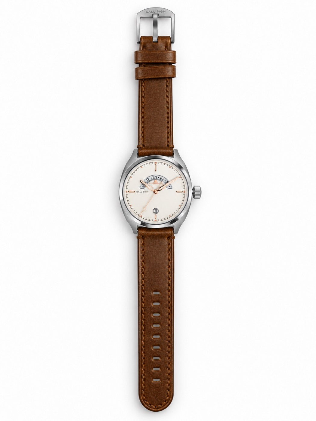 The Discovery Frost laid out full length on its brown riveted leather strap, buckle open.