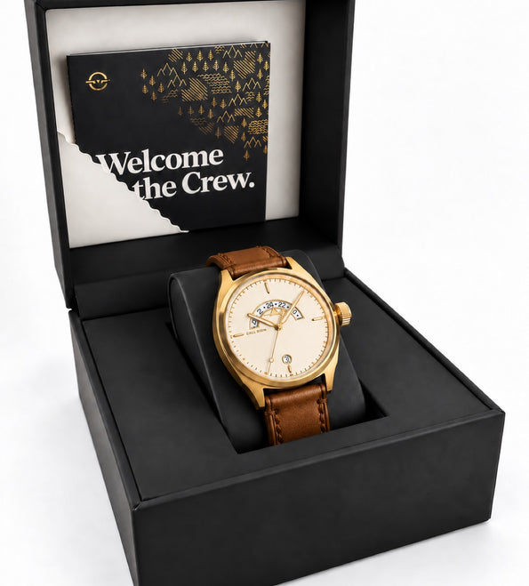 The Discovery 38 Gold on brown leather in its black Call Sign presentation box.