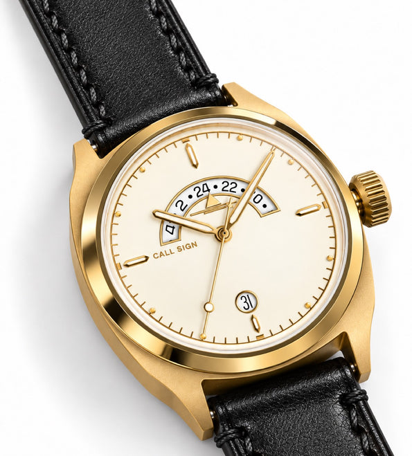 The Gold dial at an angle: crescent GMT window at 12 and gold-tone hands.