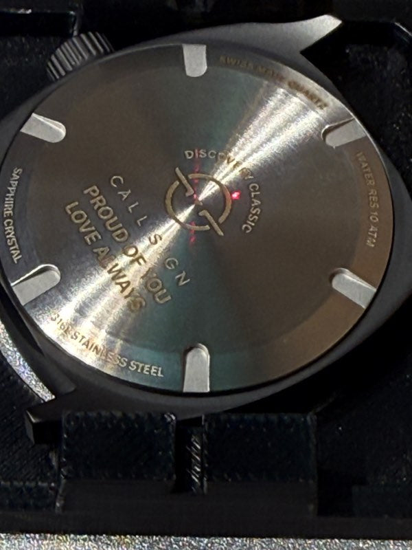 The laser engraving a Discovery caseback.