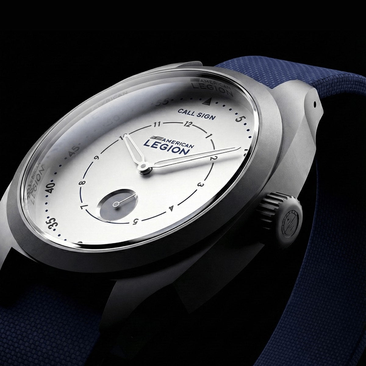Waypoint, white dual-ring dial with the American Legion emblem, steel case, on a dark ground.