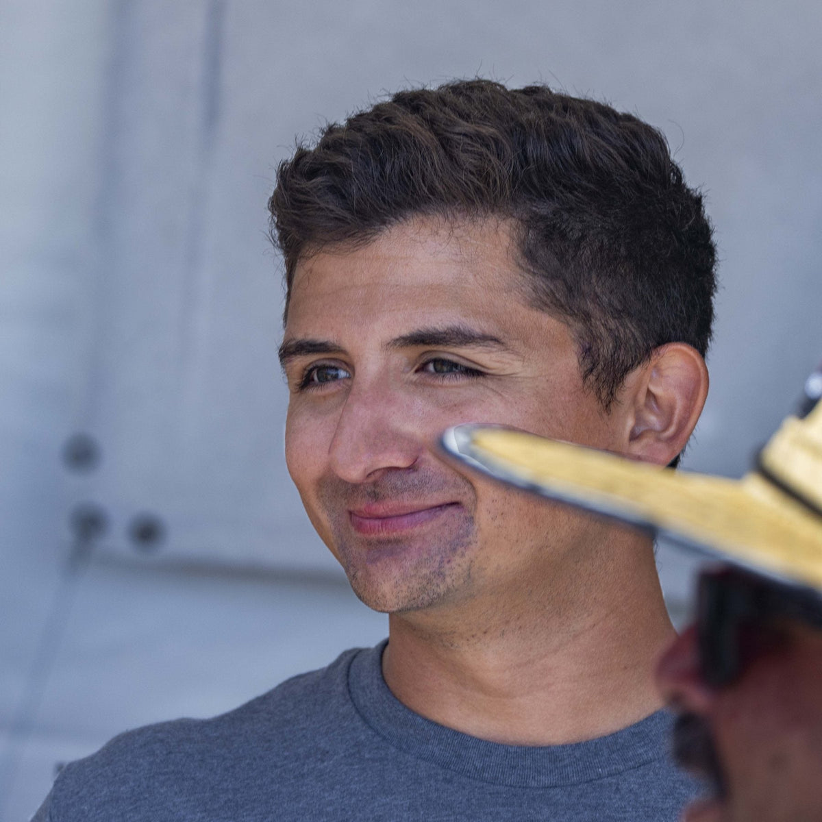 A customer in profile at the Call Sign booth.
