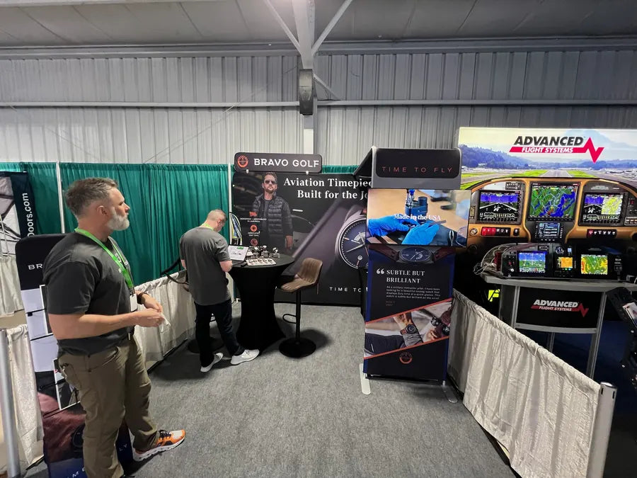 Adult visitors at the Bravo Golf booth in 2024