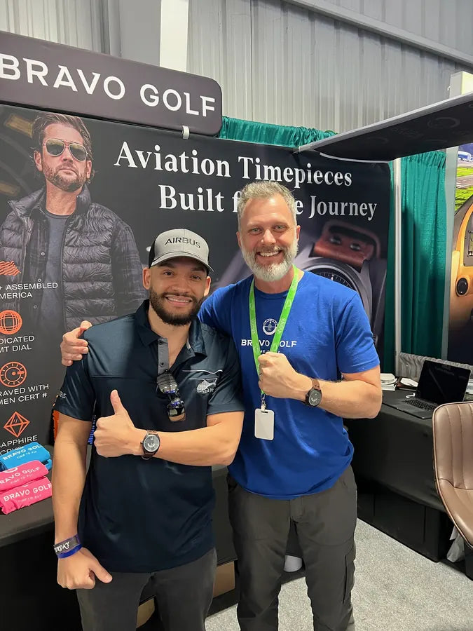 Beau and an adult customer together at a Bravo Golf booth in 2024