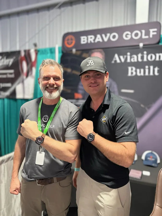 Beau and an adult pilot comparing watches at a 2024 show