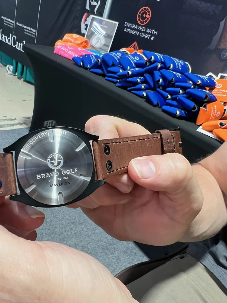The engraved back of an early Discovery watch shown by Beau at an airshow