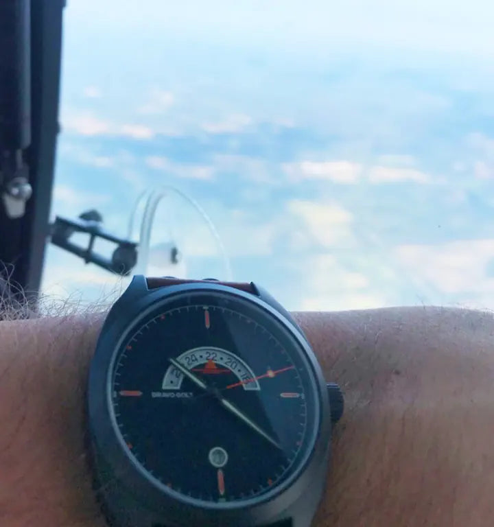 Michael D. Discovery watch beside an aircraft window