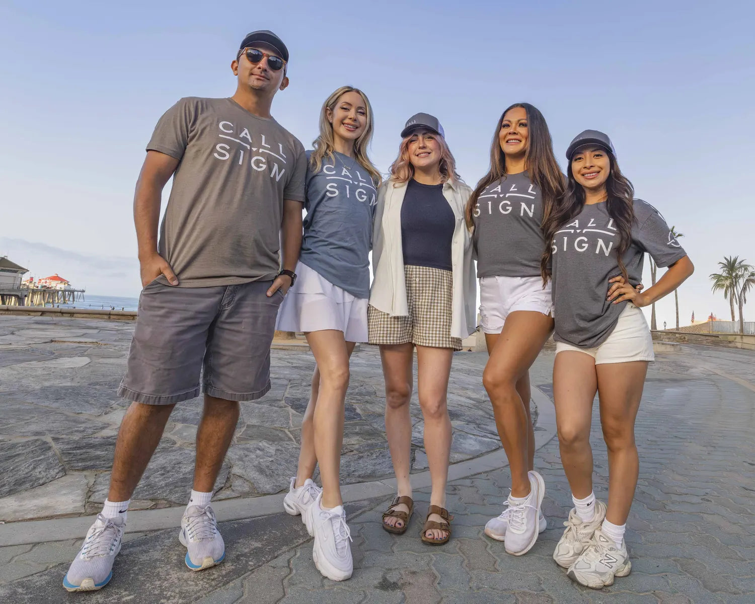 Five adult Call Sign team members together at Pacific Airshow 2025